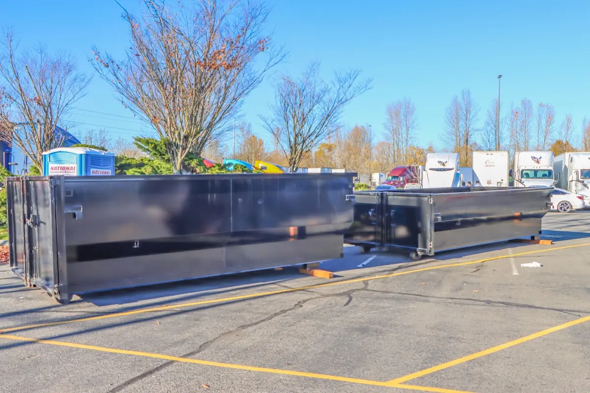 Professional dumpster rental service with roll-off container on residential driveway in Arcata